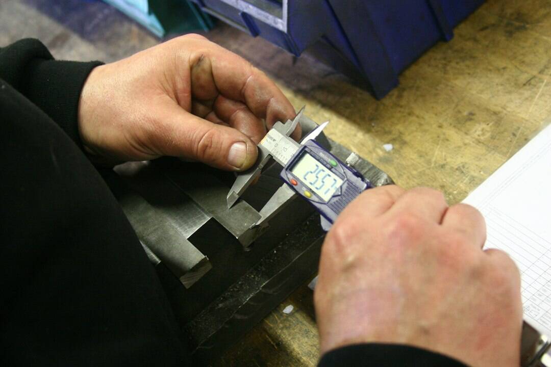 3D metrology sensor performing high-precision dimensional check on a complex machined part - custom inspection systems